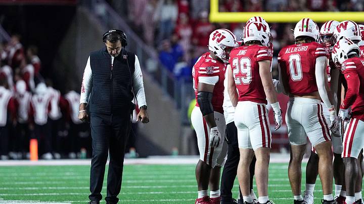 Oct 11, 2025; Madison, Wisconsin, USA; Wisconsin Badgers head coach Luke Fickell and his team take a timeout in the second half against the Iowa Hawkeyes at Camp Randall Stadium. Mandatory Credit: Ross Harried-Imagn Images