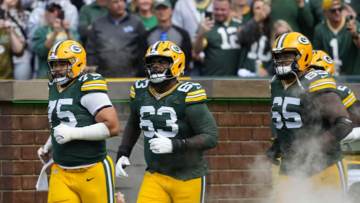 Sep 7, 2025; Green Bay, Wisconsin, USA;  Green Bay Packers guard Sean Rhyan (75), offensive tackle Rasheed Walker (63) and guard Aaron Banks (65) prior to the game against the Detroit Lions at Lambeau Field. Mandatory Credit: Jeff Hanisch-Imagn Images