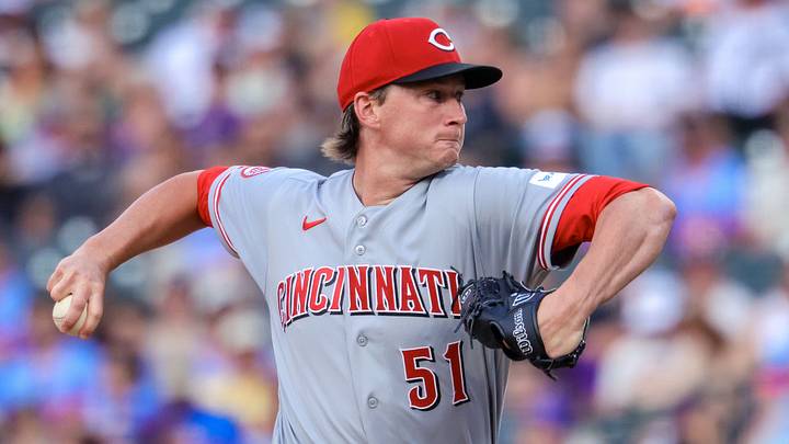 Cincinnati Reds starting pitcher Brady Singer (51) pitches