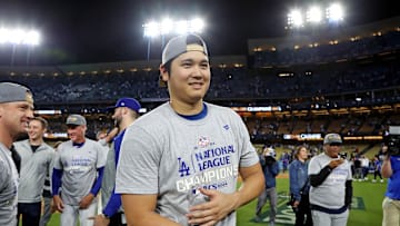 Los Angeles Dodgers two-way player Shohei Ohtani (17) celebrates after beating the New York Mets during game six of the NLCS for the 2024 MLB playoffs at Dodger Stadium.