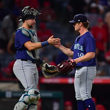 Seattle Mariners catcher Cal Raleigh (29) and pitcher Troy Taylor (59) celebrate the victory against the Los Angeles Angels at Angel Stadium on Aug 30.