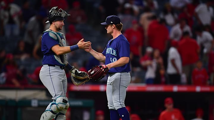 Seattle Mariners catcher Cal Raleigh (29) and pitcher Troy Taylor (59) celebrate the victory against the Los Angeles Angels at Angel Stadium on Aug 30.