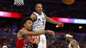 Oct 25, 2025; Orlando, Florida, USA;  Chicago Bulls guard Tre Jones (30) throws the pass to the outside as Orlando Magic guard Desmond Bane (3) defends in the second half at Kia Center. Mandatory Credit: Russell Lansford-Imagn Images