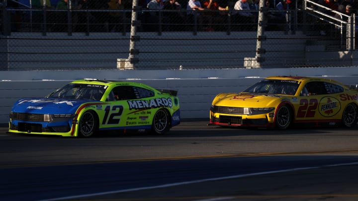 Feb 19, 2024; Daytona Beach, Florida, USA; NASCAR Cup Series driver Ryan Blaney (12) and driver Joey Logano (22) during the Daytona 500 at Daytona International Speedway. Photo Credit