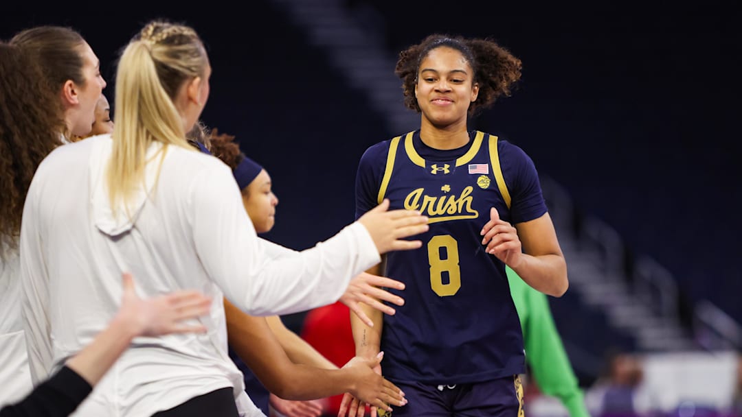 Mar 6, 2026; Duluth, GA, USA; Notre Dame Fighting Irish guard Cassandre Prosper (8) celebrates with teammates after being removed from a game against the North Carolina State Wolfpack in the fourth quarter at Gas South Arena. Mandatory Credit: Brett Davis-Imagn Images
