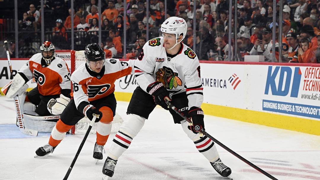 Mar 26, 2026; Philadelphia, Pennsylvania, USA; Chicago Blackhawks center Ryan Donato (8) is defended by Philadelphia Flyers defenseman Emil Andrae (36) during the second period at Xfinity Mobile Arena. Mandatory Credit: Eric Hartline-Imagn Images