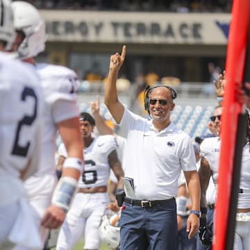 Penn State coach James Franklin smiles after the Nittany Lions score a touchdown against West Virginia. 