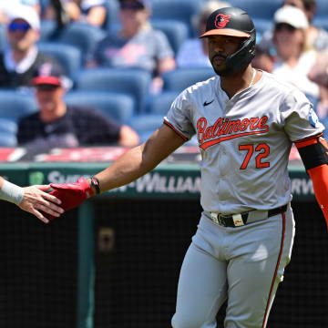 Aug 4, 2024; Cleveland, Ohio, USA; Baltimore Orioles left fielder Colton Cowser is congratulated by designated hitter Eloy Jimenez.