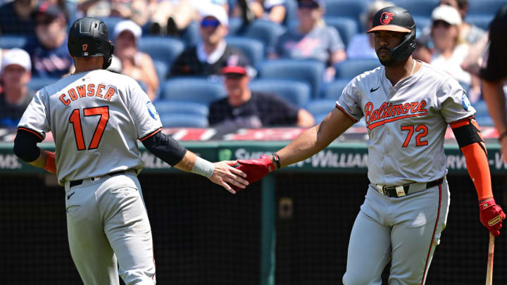 Aug 4, 2024; Cleveland, Ohio, USA; Baltimore Orioles left fielder Colton Cowser (17) is congratulated by designated hitter Eloy Jimenez (72) after scoring a run during the third inning against the Cleveland Guardians at Progressive Field. 