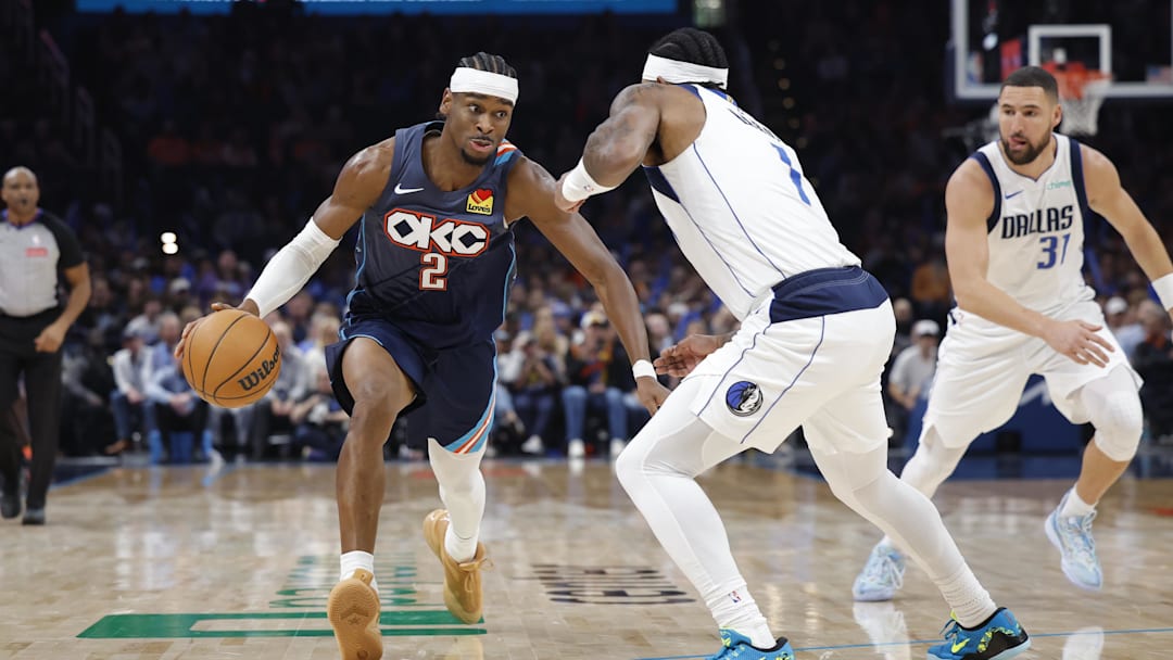 Dec 5, 2025; Oklahoma City, Oklahoma, USA; Oklahoma City Thunder guard Shai Gilgeous-Alexander (2) drives past Dallas Mavericks guard Jaden Hardy (1) during the second half at Paycom Center. Mandatory Credit: Alonzo Adams-Imagn Images
