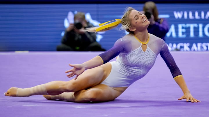 Feb 2, 2024; Baton Rouge, LA, USA;  LSU Lady Tigers senior Olivia \"Livvy\" Dunne performs a floor routine against the Arkansas Razorbacks at Pete Maravich Assembly Center. 