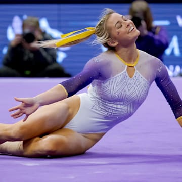 Feb 2, 2024; Baton Rouge, LA, USA;  LSU Lady Tigers senior Olivia \"Livvy\" Dunne performs a floor routine against the Arkansas Razorbacks at Pete Maravich Assembly Center.