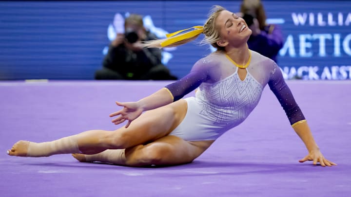 Feb 2, 2024; Baton Rouge, LA, USA;  LSU Lady Tigers senior Olivia \"Livvy\" Dunne performs a floor routine against the Arkansas Razorbacks at Pete Maravich Assembly Center. 