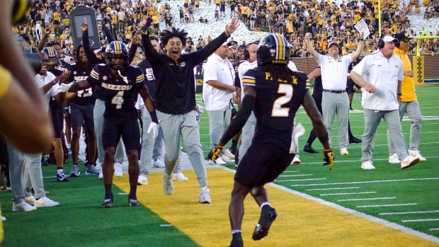 CB Toriano Pride Jr celebrates with teammates following his pick-six against Murray State in the season opener. 