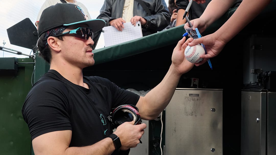 Sep 9, 2025; San Francisco, California, USA; Arizona Diamondbacks outfielder Corbin Carroll (7) signs autographs for fans before the game against the San Francisco Giants at Oracle Park. Mandatory Credit: Robert Edwards-Imagn Images