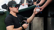 Sep 9, 2025; San Francisco, California, USA; Arizona Diamondbacks outfielder Corbin Carroll (7) signs autographs for fans before the game against the San Francisco Giants at Oracle Park. Mandatory Credit: Robert Edwards-Imagn Images