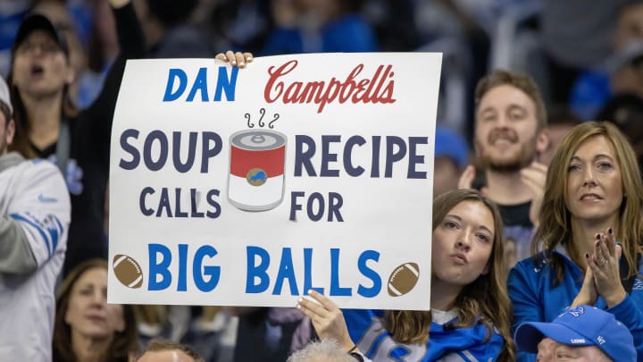 A fan hold up a Detroit Lions Head Coach Dan Campbell sign during second half of the game against the Minnesota Vikings