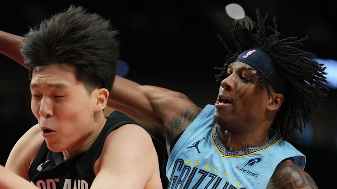 Portland Trail Blazers center Yang Hansen comes down with a rebound against Memphis Grizzlies forward GG Jackson.