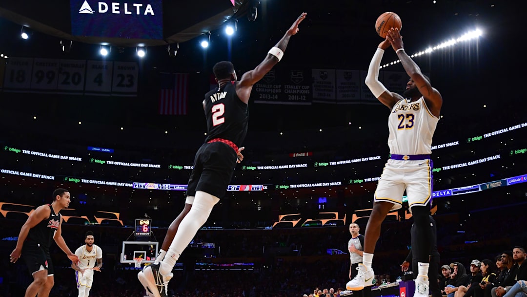 Jan 21, 2024; Los Angeles, California, USA; Los Angeles Lakers forward LeBron James (23) shoots against Portland Trail Blazers center Deandre Ayton (2) during the second half at Crypto.com Arena. Mandatory Credit: Gary A. Vasquez-Imagn Images