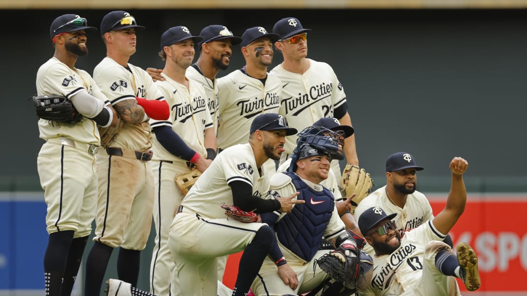 Jun 12, 2024; Minneapolis, Minnesota, USA; The Minnesota Twins pose for a photo to celebrate the win against the Colorado Rockies after the game at Target Field. Mandatory Credit: Bruce Kluckhohn-USA TODAY Sports