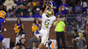 Nov 22, 2025; Atlanta, Georgia, USA; Georgia Tech Yellow Jackets wide receiver Isiah Canion (4) catches a pass for a touchdown against the Pittsburgh Panthers in the second quarter at Bobby Dodd Stadium at Hyundai Field. Mandatory Credit: Brett Davis-Imagn Images
