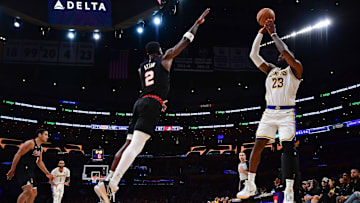 Jan 21, 2024; Los Angeles, California, USA; Los Angeles Lakers forward LeBron James (23) shoots against Portland Trail Blazers center Deandre Ayton (2) during the second half at Crypto.com Arena. Mandatory Credit: Gary A. Vasquez-Imagn Images