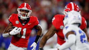 Georgia wide receiver Arian Smith (11) moves the rock during the first half of a NCAA college football game against Kentucky in Athens, Ga., on Saturday, Oct. 7, 2023.