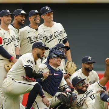 Jun 12, 2024; Minneapolis, Minnesota, USA; The Minnesota Twins pose for a photo to celebrate the win against the Colorado Rockies after the game at Target Field. Mandatory Credit: Bruce Kluckhohn-USA TODAY Sports