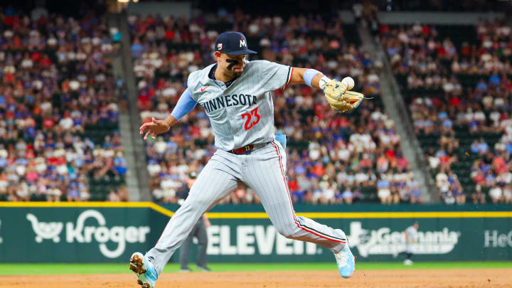 Minnesota Twins third baseman Royce Lewis (23) cannot cleanly field a ground ball at third base during the second inning against the Texas Rangers at Globe Life Field on Aug 17.