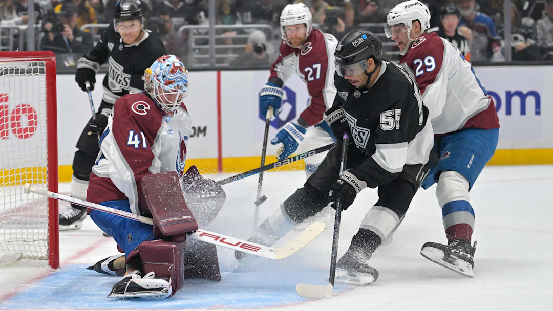 Apr 23, 2026; Los Angeles, California, USA; Colorado Avalanche center Nathan MacKinnon (29) defends as Colorado Avalanche goaltender Scott Wedgewood (41) makes a save off a shot on goal by Los Angeles Kings right wing Quinton Byfield (55) in the second period of game three of the first round of the 2026 Stanley Cup Playoffs at Crypto.com Arena. Mandatory Credit: Jayne Kamin-Oncea-Imagn Images