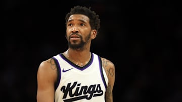 Mar 14, 2025; Phoenix, Arizona, USA; Sacramento Kings guard Malik Monk (0) against the Phoenix Suns at Footprint Center. Mandatory Credit: Mark J. Rebilas-Imagn Images