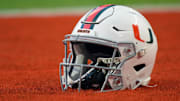 Sep 30, 2021; Miami Gardens, Florida, USA; A general view of a Miami Hurricanes helmet in the end zone prior to the game between the Miami Hurricanes and the Virginia Cavaliers at Hard Rock Stadium. Mandatory Credit: Jasen Vinlove-Imagn Images