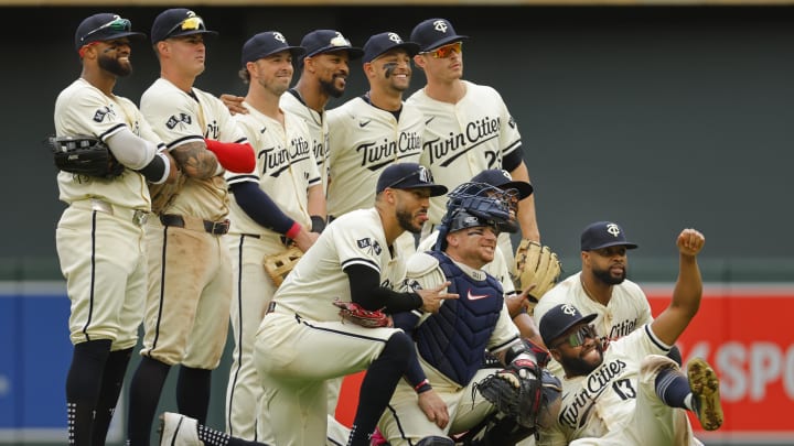 Jun 12, 2024; Minneapolis, Minnesota, USA; The Minnesota Twins pose for a photo to celebrate the win against the Colorado Rockies after the game at Target Field.