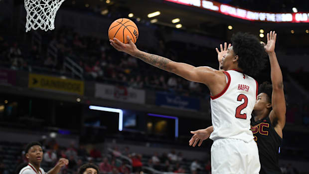Rutgers Scarlet Knights guard Dylan Harper (2) scores past USC Trojans guard Wesley Yates III (6) 