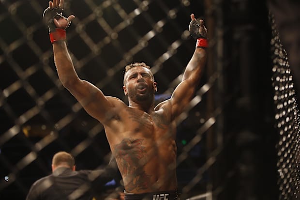 Mike Davis (red gloves) reacts against Thomas Gifford (not pictured) during UFC Fight Night at Amalie Arena. 