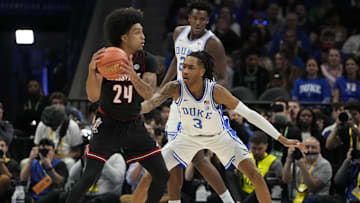 Mar 15, 2025; Charlotte, NC, USA; Duke basketball guard Isaiah Evans (3) guards Louisville Cardinals guard Chucky Hepburn (24) in the first half of the 2025 ACC Conference Championship game at Spectrum Center.