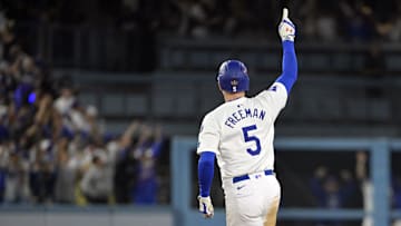 Oct 25, 2024; Los Angeles, California, USA; Los Angeles Dodgers first baseman Freddie Freeman (5) runs after hitting a grand slam home run in the tenth inning against the New York Yankees during game one of the 2024 MLB World Series at Dodger Stadium. 