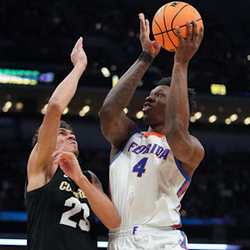 Mar 22, 2024; Indianapolis, IN, USA; Florida Gators forward Tyrese Samuel (4) shoots against Colorado Buffaloes forward Tristan da Silva (23) in the second half in the first round of the 2024 NCAA Tournament at Gainbridge FieldHouse. Mandatory Credit: Robert Goddin-Imagn Images