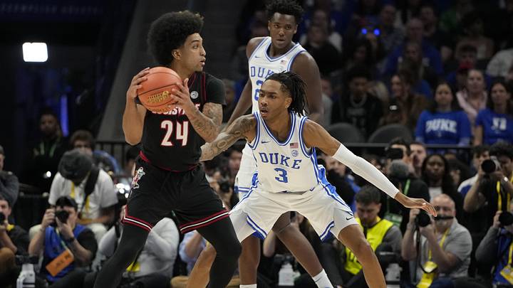 Mar 15, 2025; Charlotte, NC, USA; Duke basketball guard Isaiah Evans (3) guards Louisville Cardinals guard Chucky Hepburn (24) in the first half of the 2025 ACC Conference Championship game at Spectrum Center.