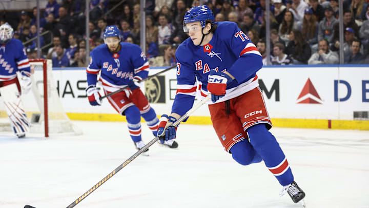 Apr 17, 2025; New York, New York, USA;  New York Rangers center Matt Rempe (73) controls the puck in the second period against the Tampa Bay Lightning at Madison Square Garden. Mandatory Credit: Wendell Cruz-Imagn Images