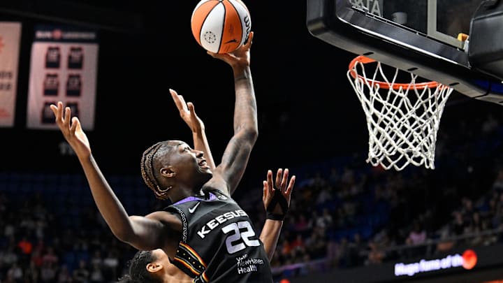 Aug 13, 2025; Uncasville, Connecticut, USA; Connecticut Sun guard Saniya Rivers (22) reaches for the rebound during the second half against the Chicago Sky at Mohegan Sun Arena. Mandatory Credit: Eric Canha-Imagn Images