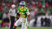 Jan 1, 2025; Pasadena, CA, USA; Oregon Ducks wide receiver Tez Johnson (15) runs against the Ohio State Buckeyes in the second half  in the 2025 Rose Bowl college football quarterfinal game at Rose Bowl Stadium. Mandatory Credit: Gary A. Vasquez-Imagn Images