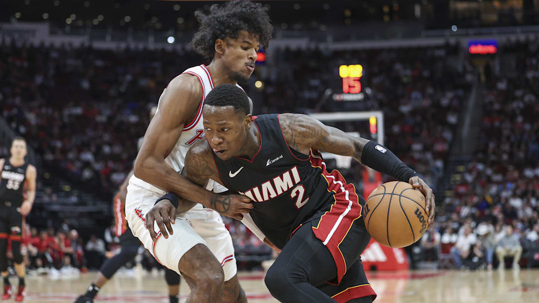 Apr 5, 2024; Houston, Texas, USA; Miami Heat guard Terry Rozier (2) drives with the ball as Houston Rockets guard Jalen Green (4) defends during the third quarter at Toyota Center. Mandatory Credit: Troy Taormina-Imagn Images