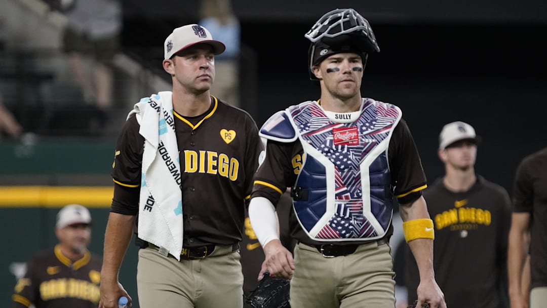 San Diego Padres pitcher Michael King (34) and catcher Brett Sullivan (29) walk in from the bullpen prior to a game against the Texas Rangers at Globe Life Field. 