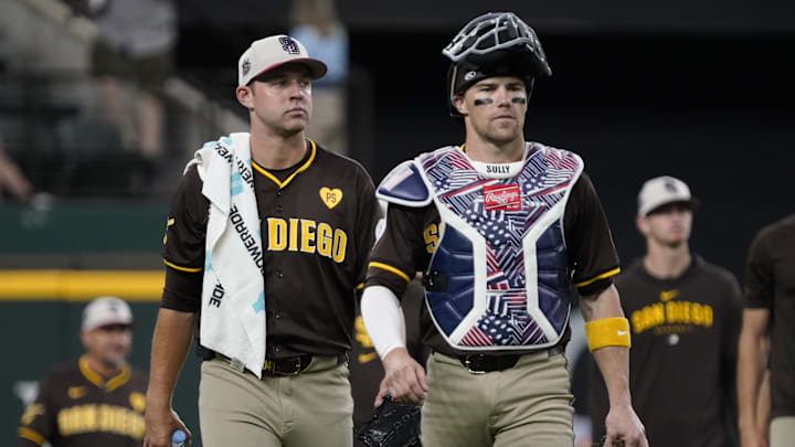 San Diego Padres pitcher Michael King (34) and catcher Brett Sullivan (29) walk in from the bullpen prior to a game against the Texas Rangers at Globe Life Field. 