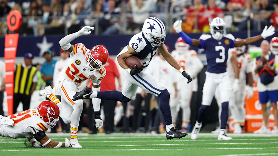 Dallas Cowboys running back Malik Davis (43) runs past Kansas City Chiefs safety Chamarri Conner (27) for a touchdown.