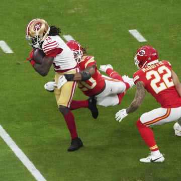 Feb 11, 2024; Paradise, Nevada, USA;  San Francisco 49ers wide receiver Brandon Aiyuk (11) runs with the ball as Kansas City Chiefs safety Justin Reid (20) defends during the first quarter of Super Bowl LVIII at Allegiant Stadium. Mandatory Credit: Joe Camporeale-USA TODAY Sports