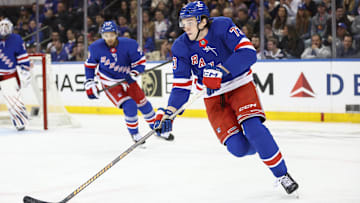 Apr 17, 2025; New York, New York, USA;  New York Rangers center Matt Rempe (73) controls the puck in the second period against the Tampa Bay Lightning at Madison Square Garden. Mandatory Credit: Wendell Cruz-Imagn Images