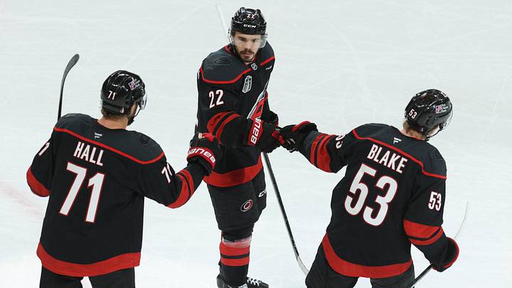 Jun 4, 2026; Raleigh, North Carolina, USA; Carolina Hurricanes left wing Taylor Hall (71) and right wing Jackson Blake (53) congratulate center Logan Stankoven (22) for scoring during the third period against the Vegas Golden Knights in game two of the 2026 Stanley Cup Final at Lenovo Center. Mandatory Credit: Nathan Ray Seebeck-Imagn Images