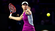 Elena Rybakina returns a ball during the WTA Finals.